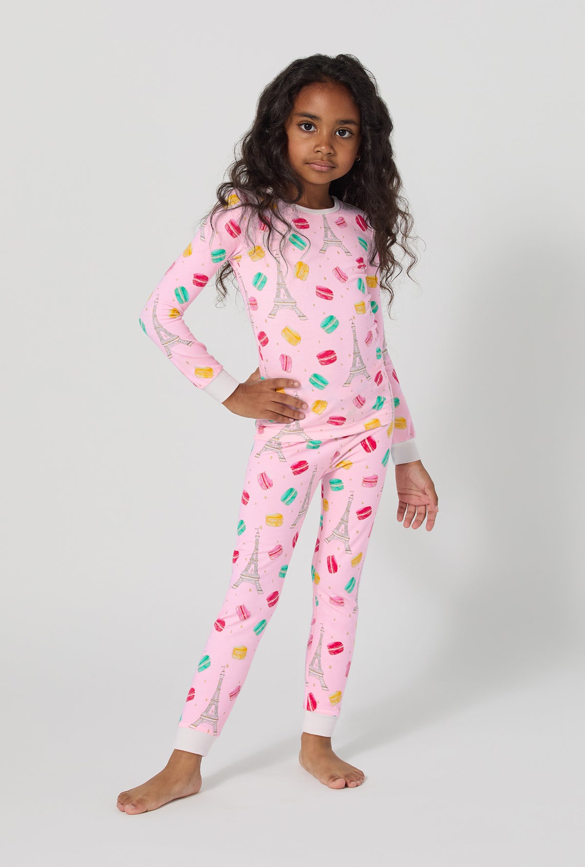 A girl wearing Eiffel For You Long Sleeve Stretch Jersey Kids Pj Set