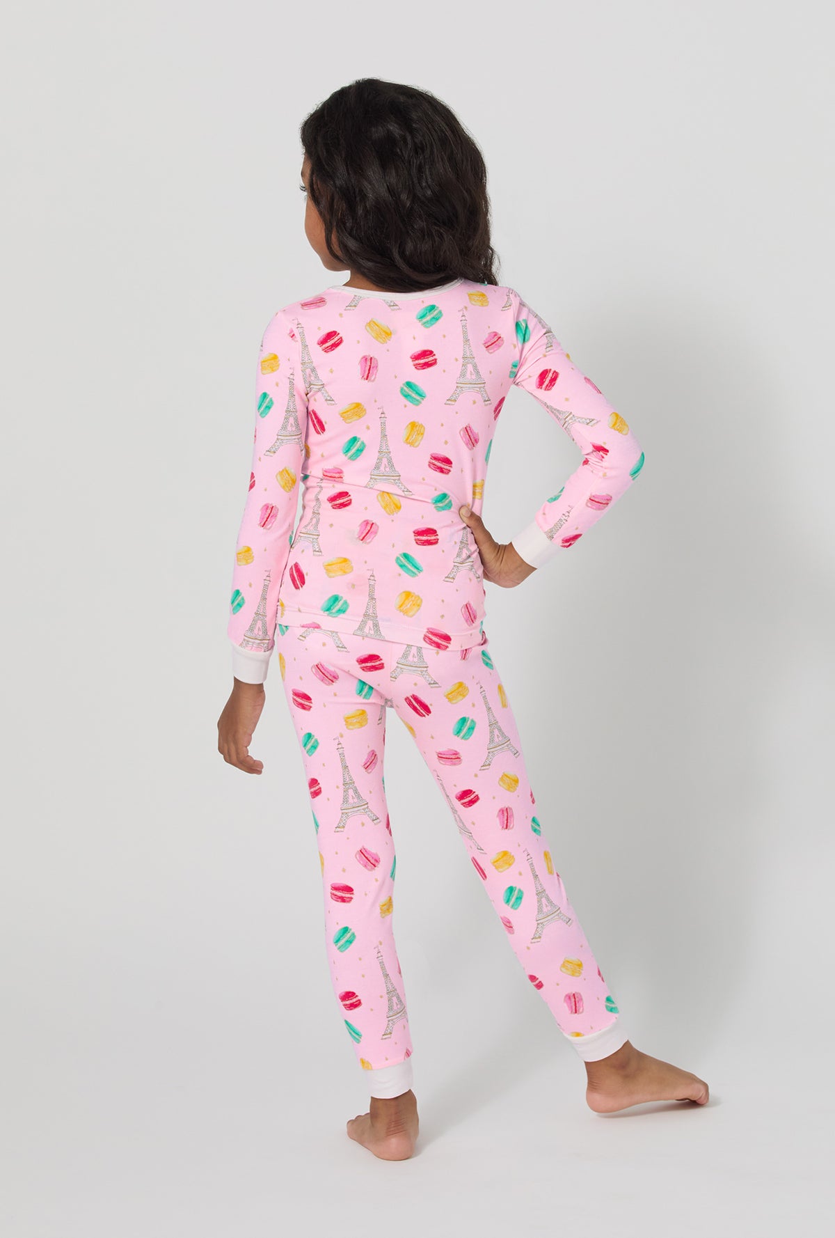 A girl wearing Eiffel For You Long Sleeve Stretch Jersey Kids Pj Set