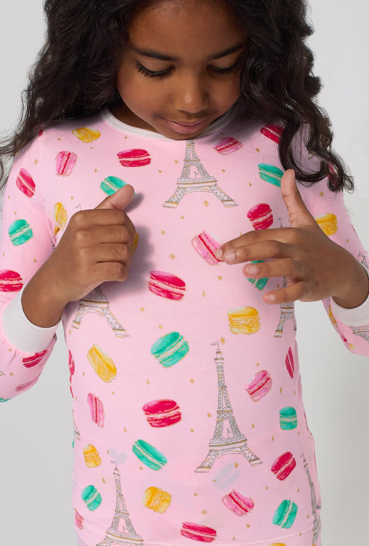 A girl wearing Eiffel For You Long Sleeve Stretch Jersey Kids Pj Set