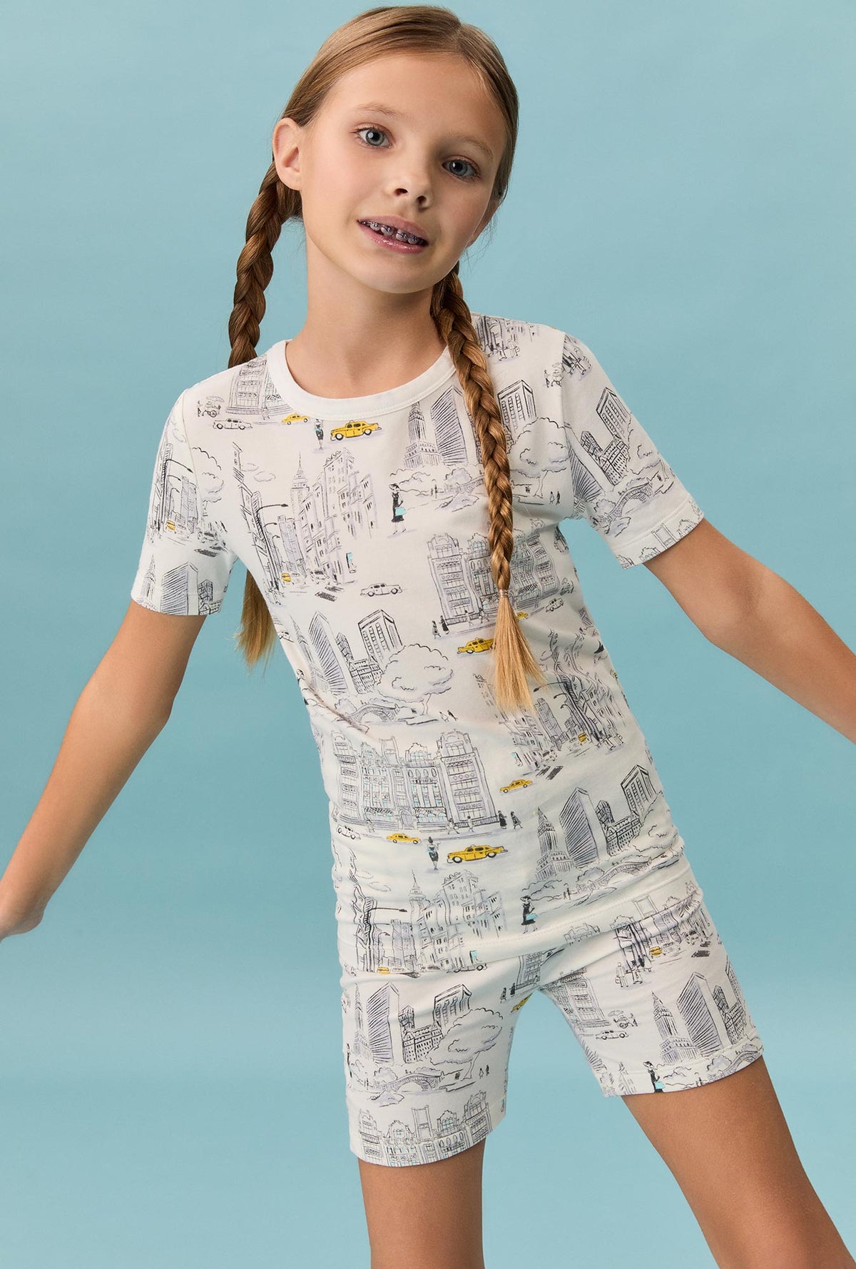 A girl wearing City That Never Sleeps Short Sleeve Stretch Jersey Kids Short PJ Set