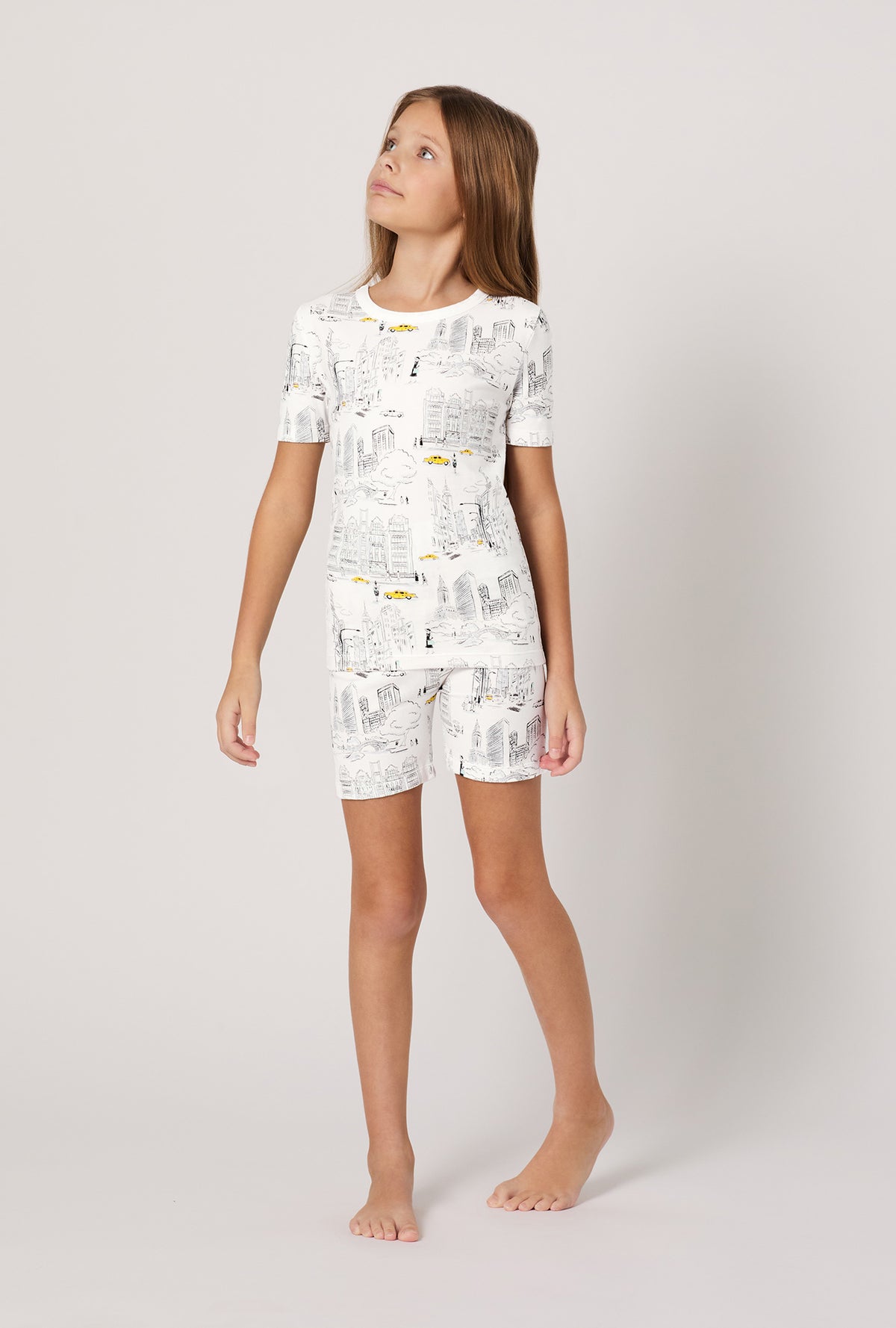 A girl wearing City That Never Sleeps Short Sleeve Stretch Jersey Kids Short PJ Set