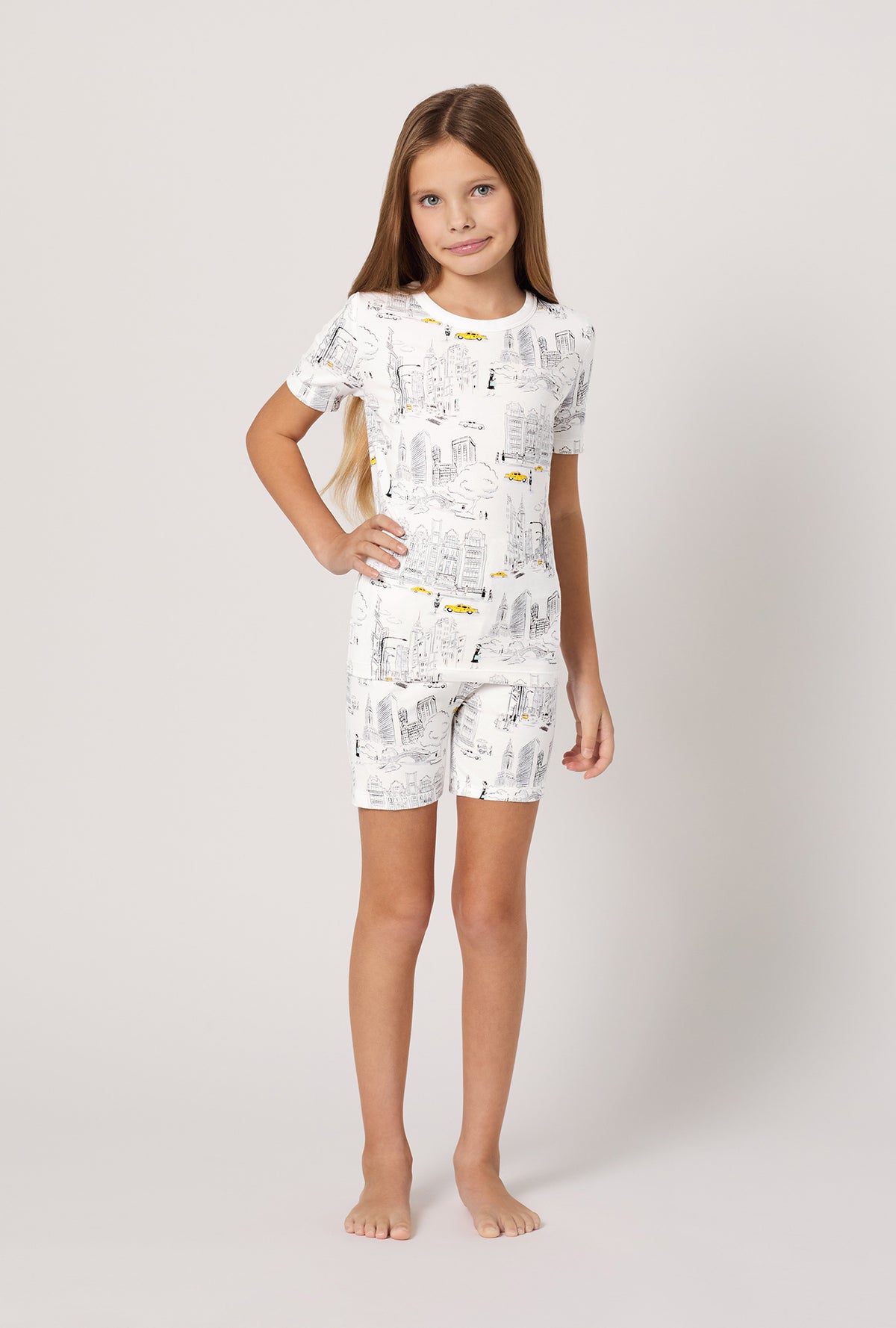 A girl wearing City That Never Sleeps Short Sleeve Stretch Jersey Kids Short PJ Set