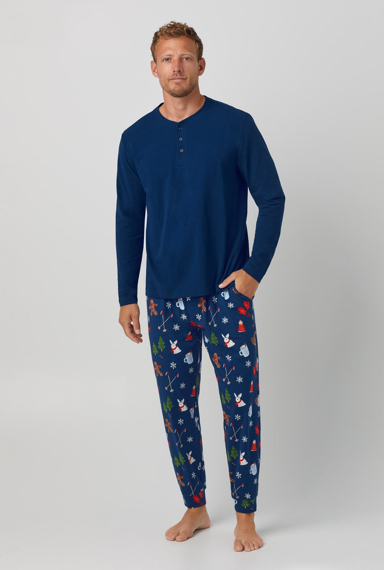A man wearing blue Long Sleeve Jogger Stretch Jersey PJ Set with Seasonal Delights print