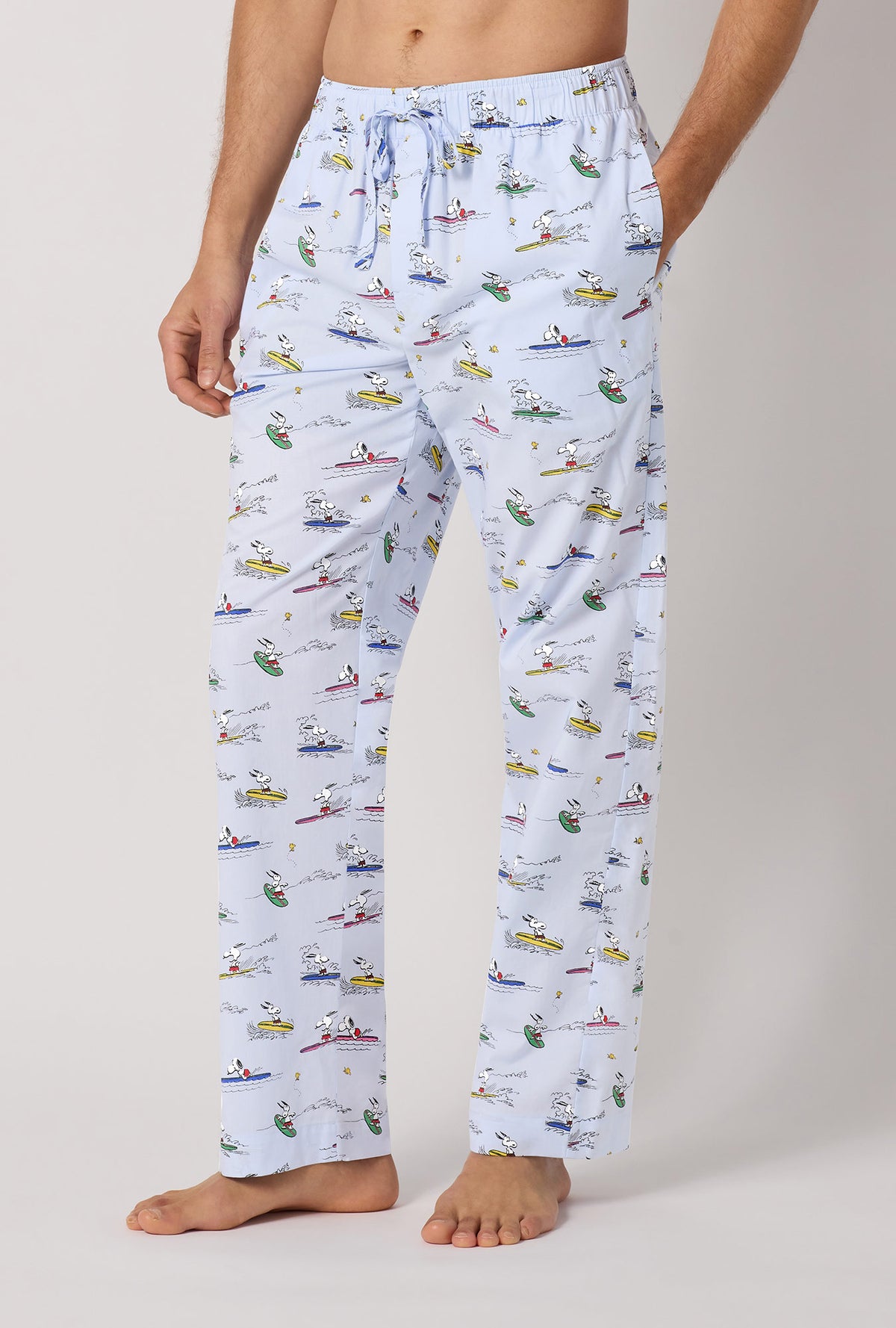 A man wearing Catch A Wave, Snoopy Men's Woven Cotton Poplin Pj Pant side look