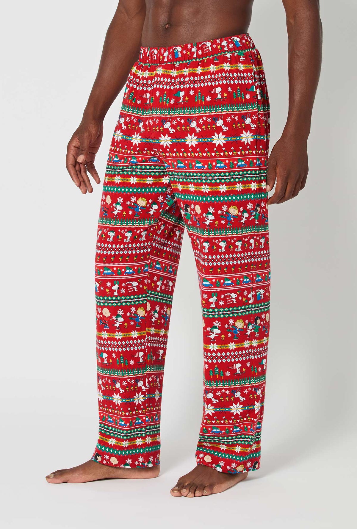 A man wearing Peanuts®  Winter Fairisle Men&#39;s Stretch Jersey Pj Pant