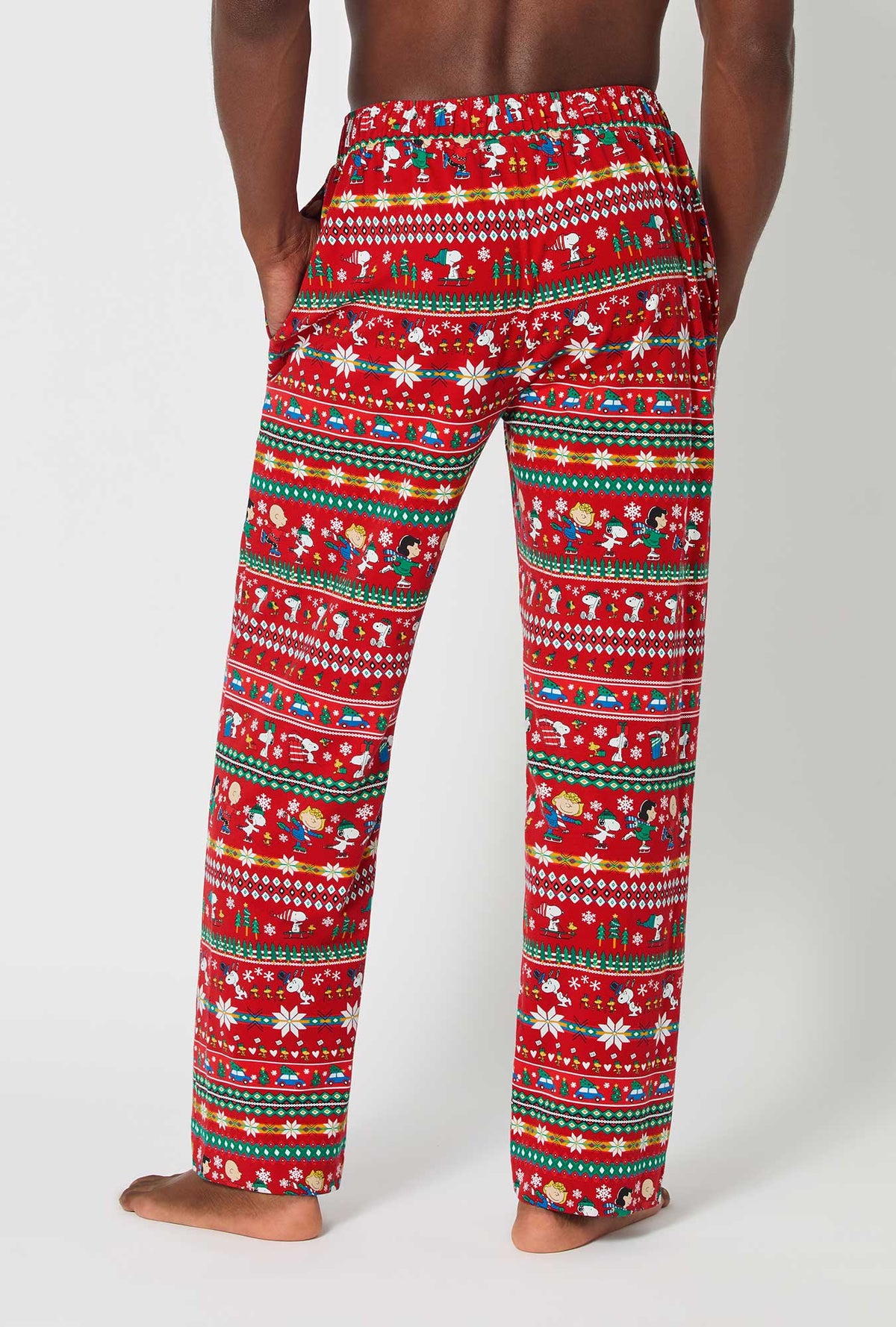 A man wearing Peanuts®  Winter Fairisle Men&#39;s Stretch Jersey Pj Pant
