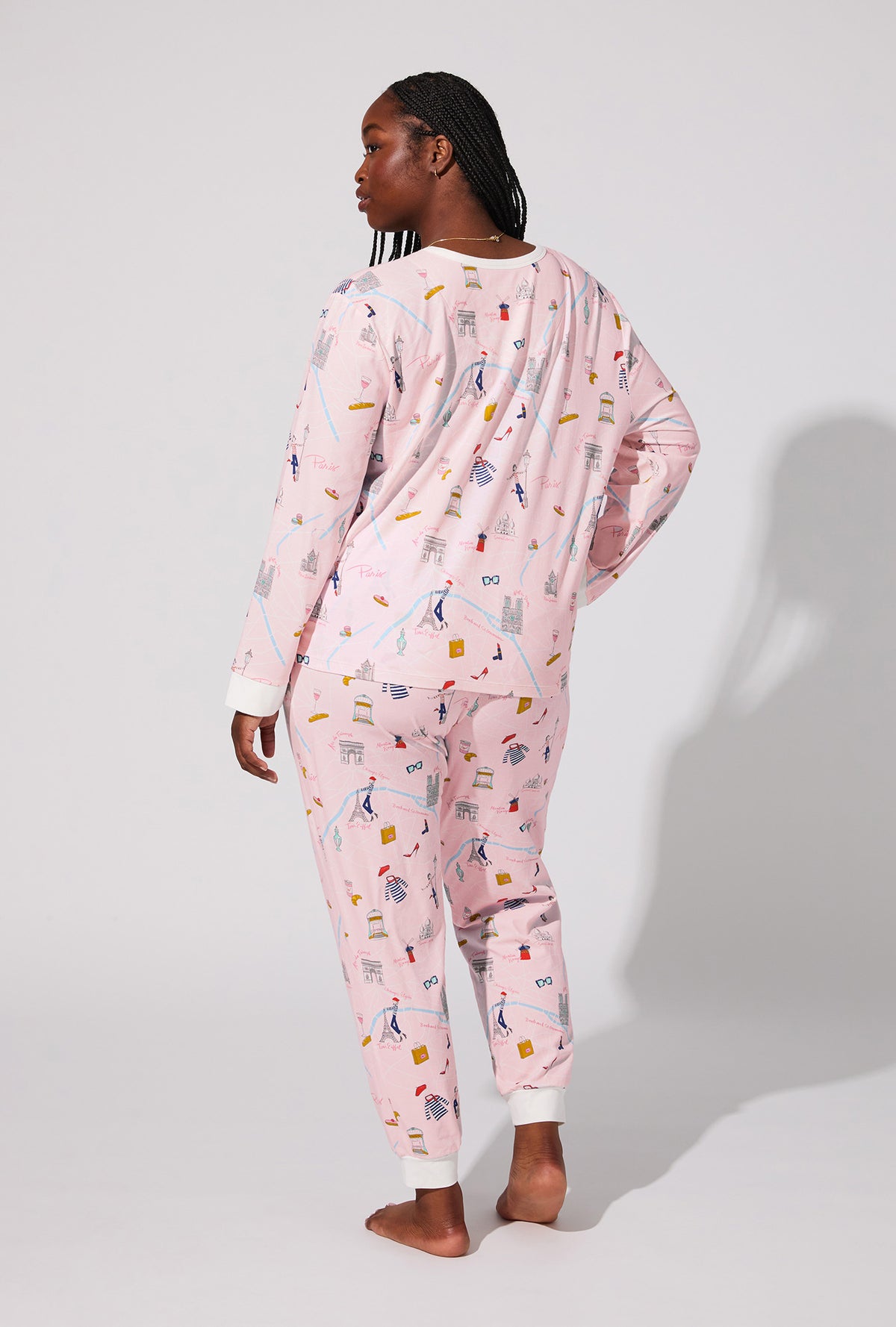A lady wearing 48 Hrs In Paris  Long Sleeve Pullover Crew and Jogger Stretch Jersey PJ Set
