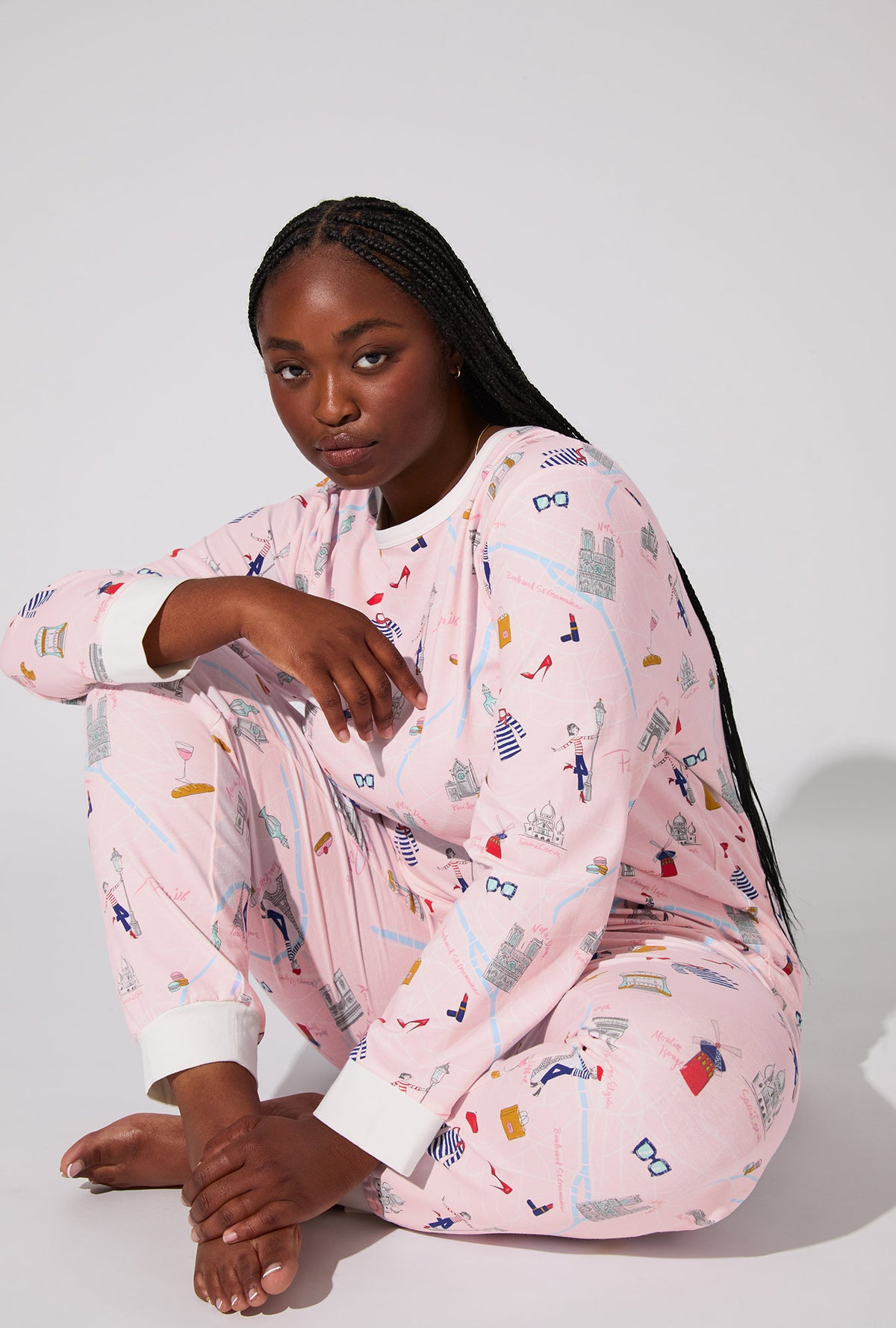 A lady wearing 48 Hrs In Paris  Long Sleeve Pullover Crew and Jogger Stretch Jersey PJ Set