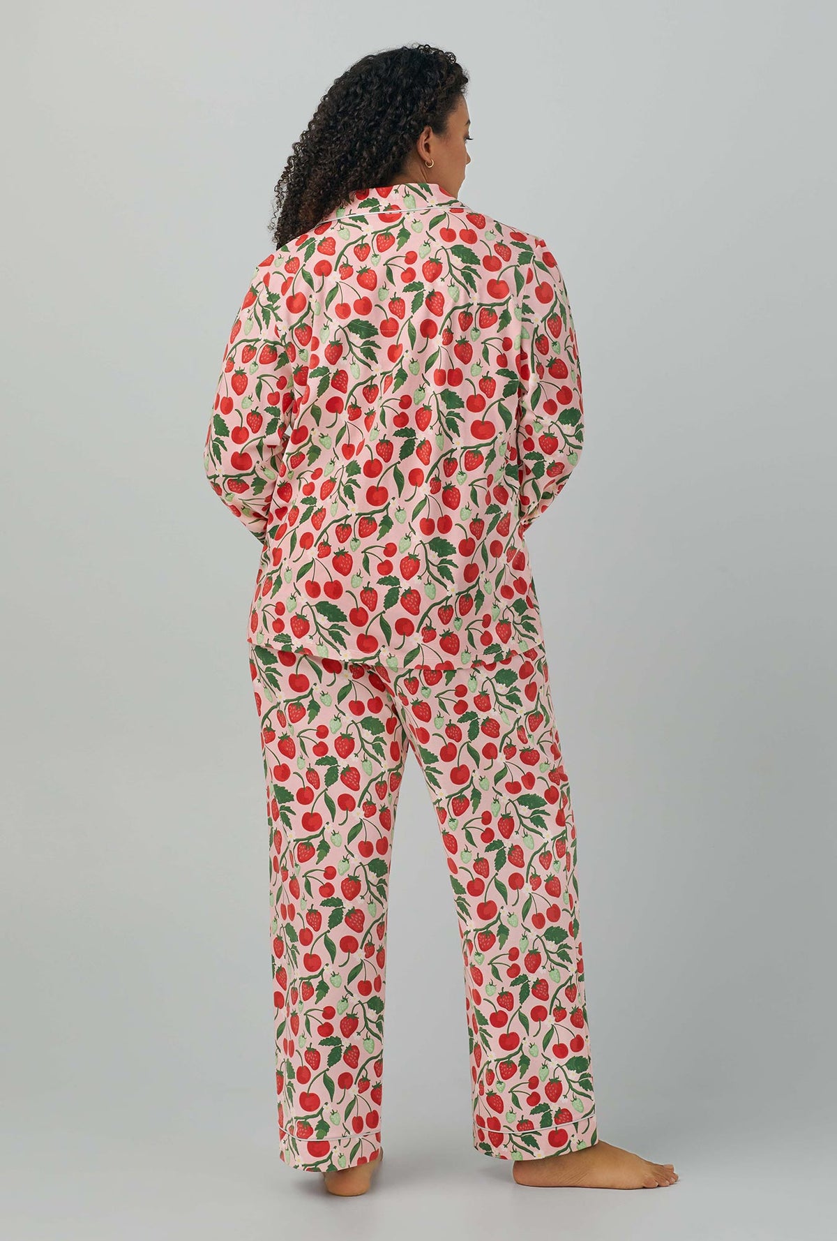 A lady wearing Long Sleeve Classic Stretch Jersey PJ Set with berry bliss print