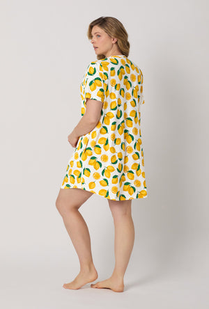 A lady wearing plus size White and  Yellow Stretch Jersey T-Shirt Sleep Dress back view