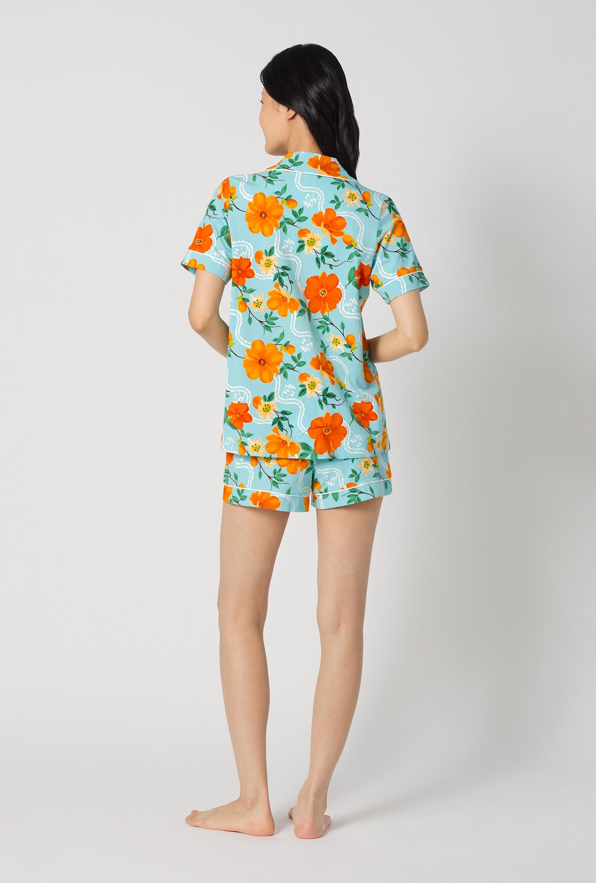 A lady wearing Golden Breeze Short Sleeve Classic Shorty Stretch Jersey Pj Set back view