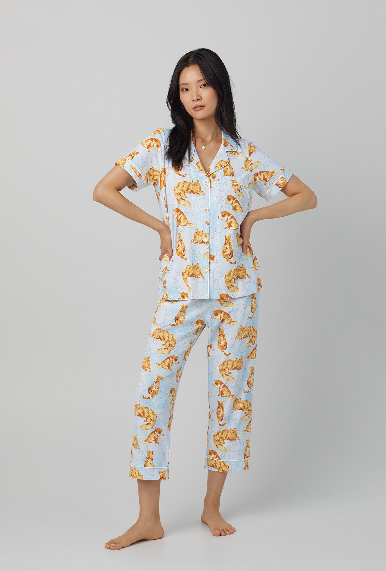 A lady wearing short sleeve classic stretch jersey cropped pj set with fancy cats print