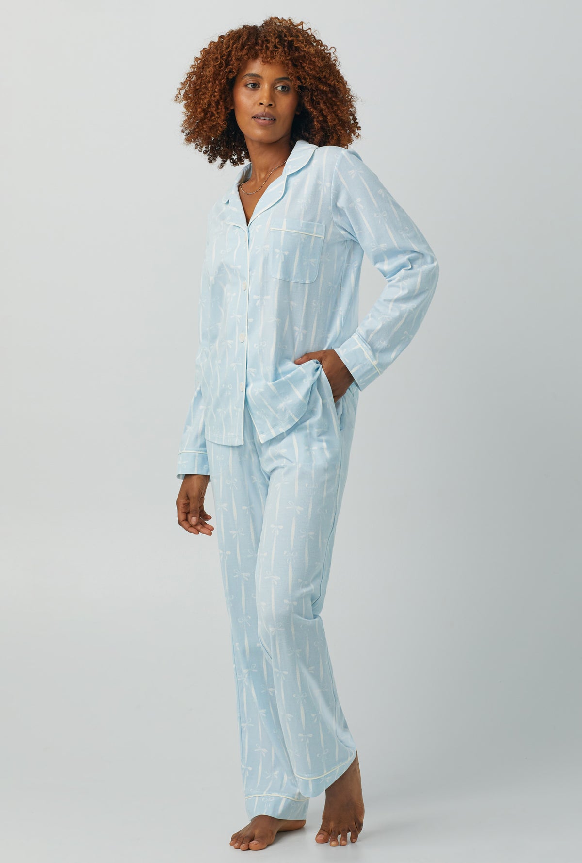 A lady wearing Long Sleeve Classic Stretch Jersey PJ Set with tying the knot print