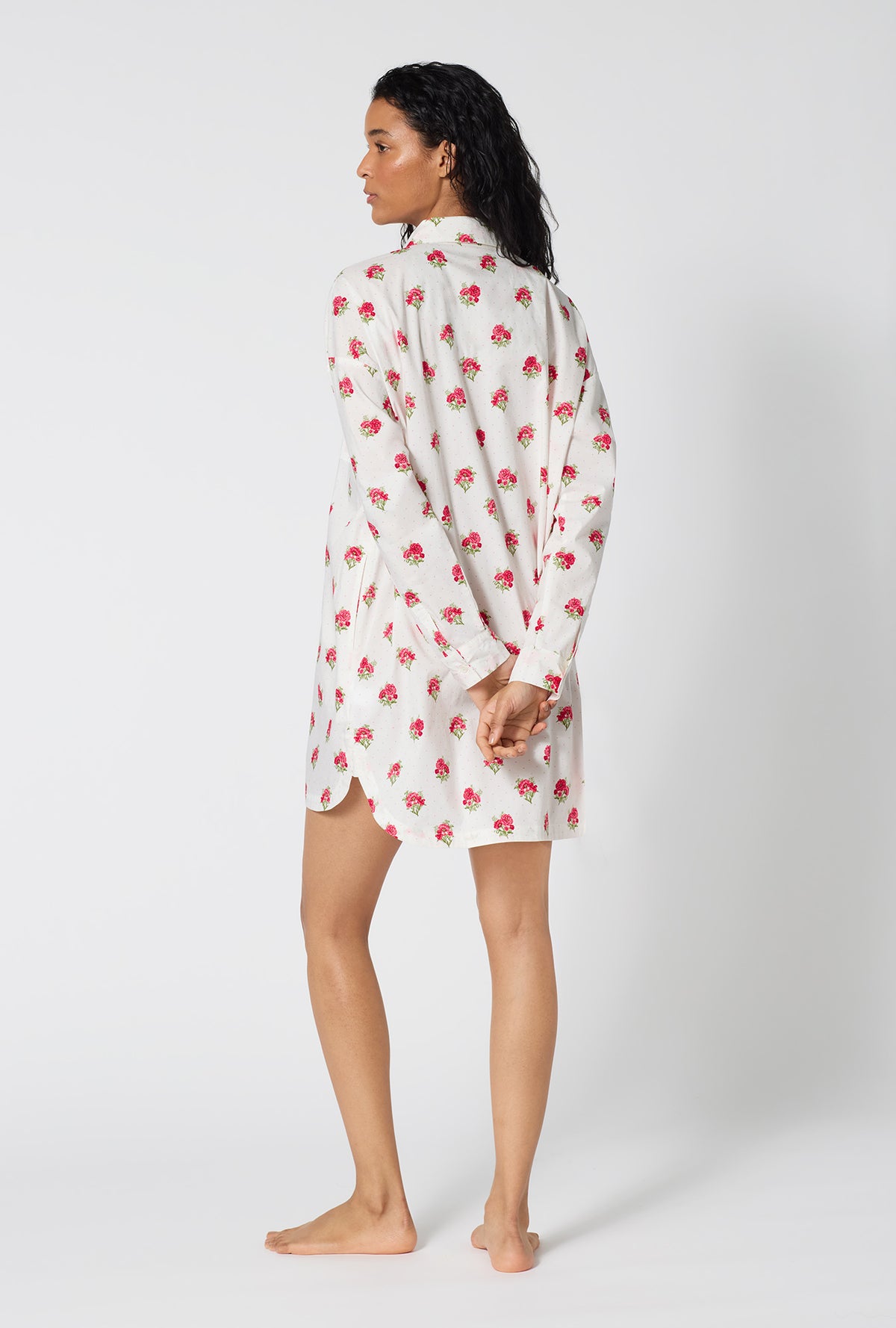 A Lady Wearing Celeste High Low Woven Supersoft Cotton Poplin Boyfriend Shirt showing a back view  pose while looking to the side