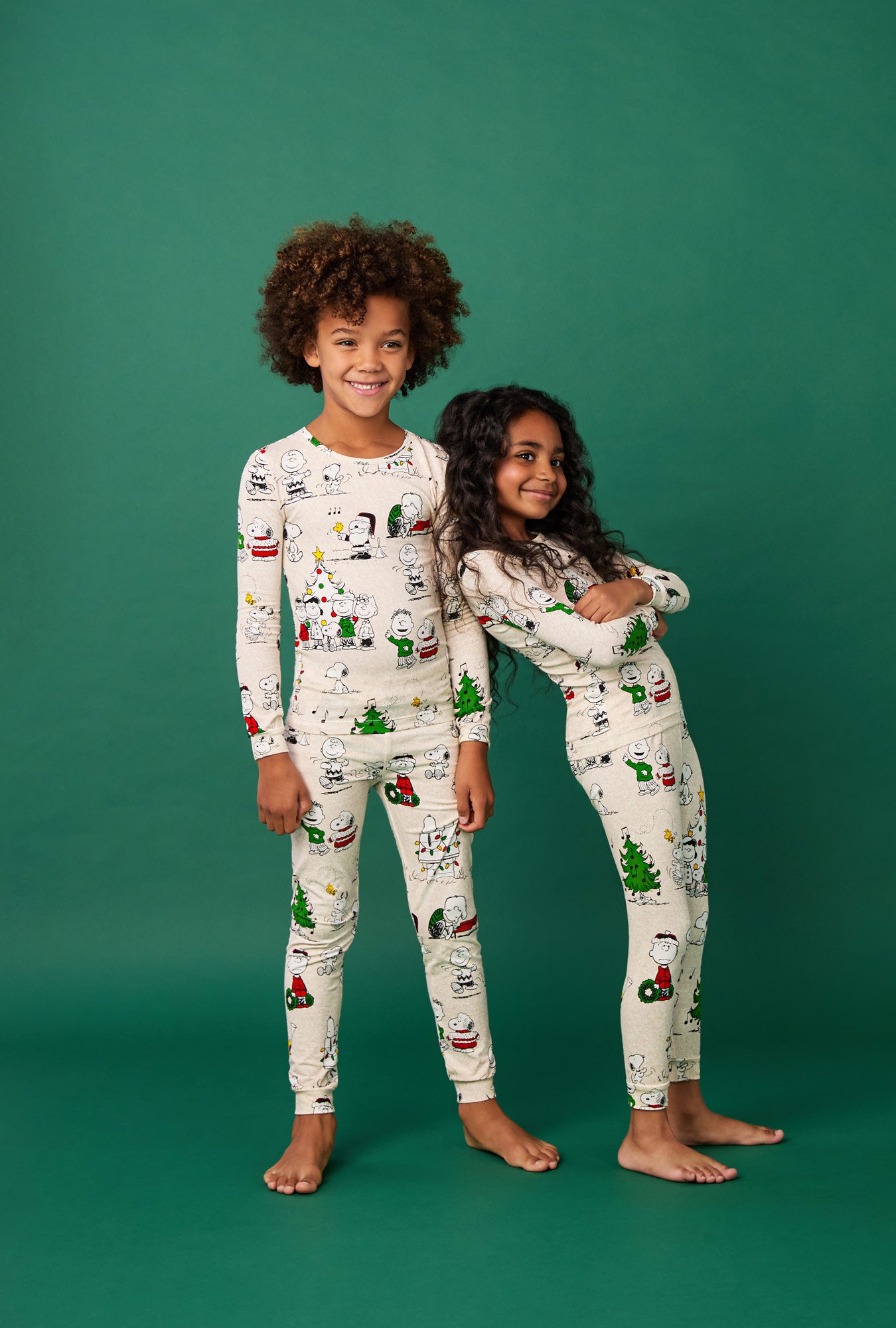 2 kids wearing Peanuts® Celebration Long Sleeve Stretch Jersey Kids Pj Set