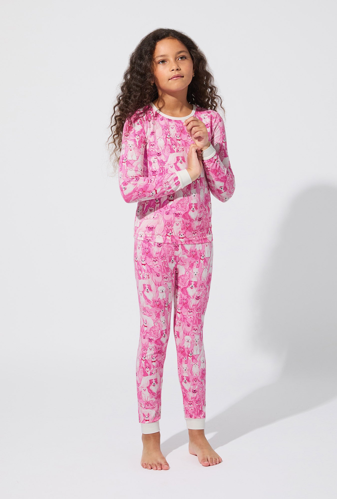 A girl wearing Paw-fectly Pink Long Sleeve Stretch Jersey Kids PJ Set