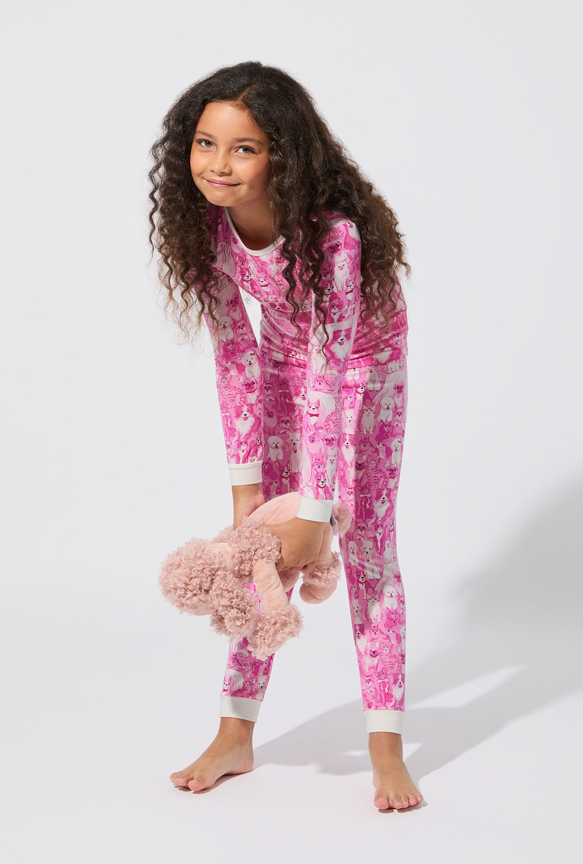 A girl wearing Paw-fectly Pink Long Sleeve Stretch Jersey Kids PJ Set