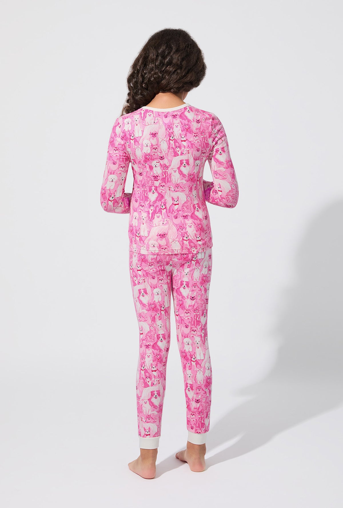 A girl wearing Paw-fectly Pink Long Sleeve Stretch Jersey Kids PJ Set