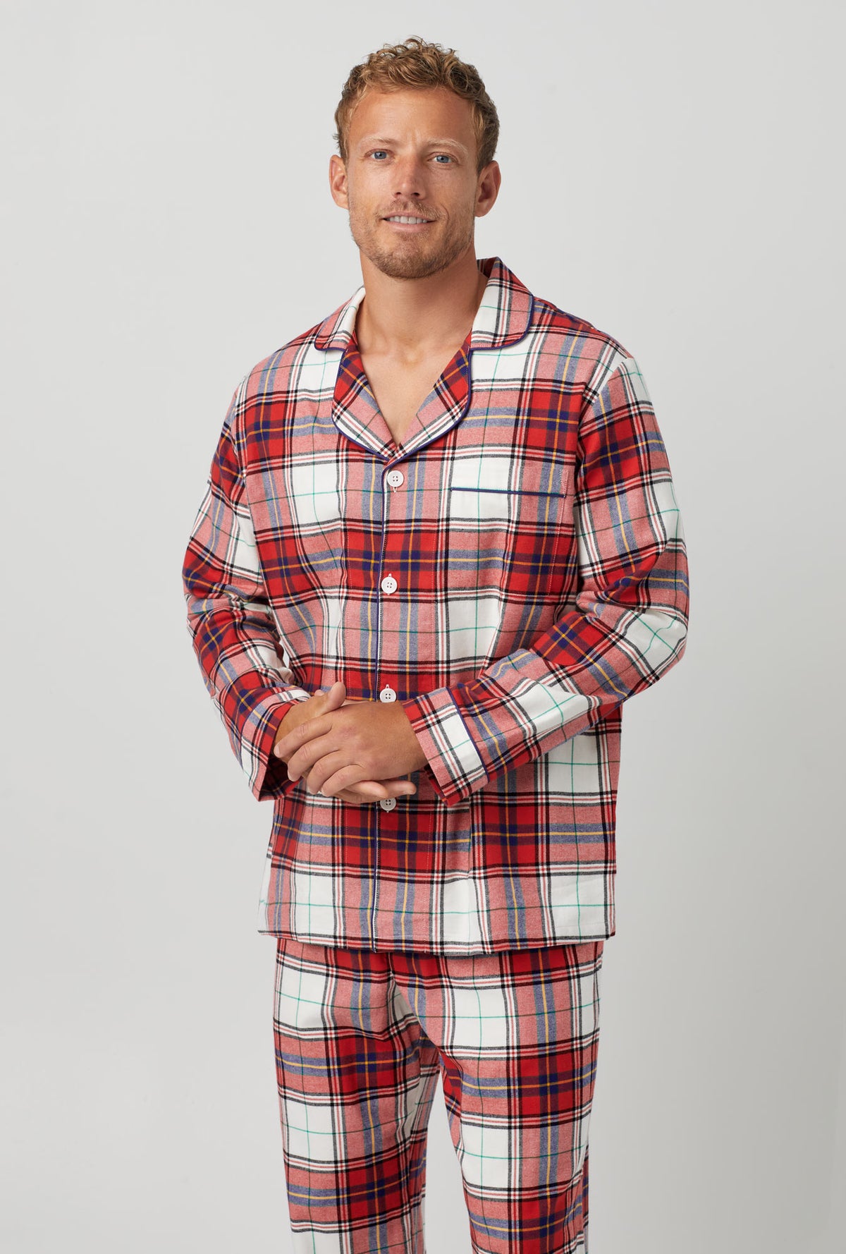 A man wearing Long Sleeve Classic Woven Cotton Portuguese Flannel PJ Set with Festive Tartan print