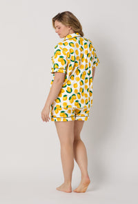 A lady wearing plus size White and  Yellow Short Sleeve Classic Shorty Stretch Jersey Pj Set back view