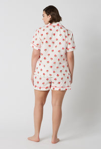 A Lady Wearing Plus Size Celeste Short Sleeve Classic Woven Supersoft Cotton Poplin Shorty Pj Set in a back view pose