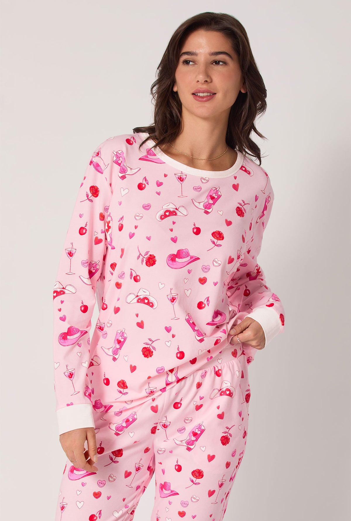 A lady wearing Giddy Up Galentine Long Sleeve Pullover Crew And Jogger Stretch Jersey Pj Set
