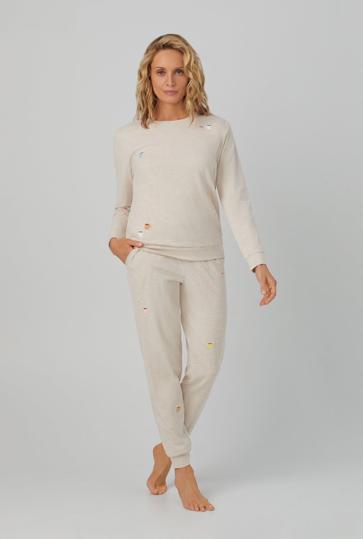 A lady wearing Long Sleeve Pullover Crew and Jogger Stretch Jersey PJ Set with latte heather print