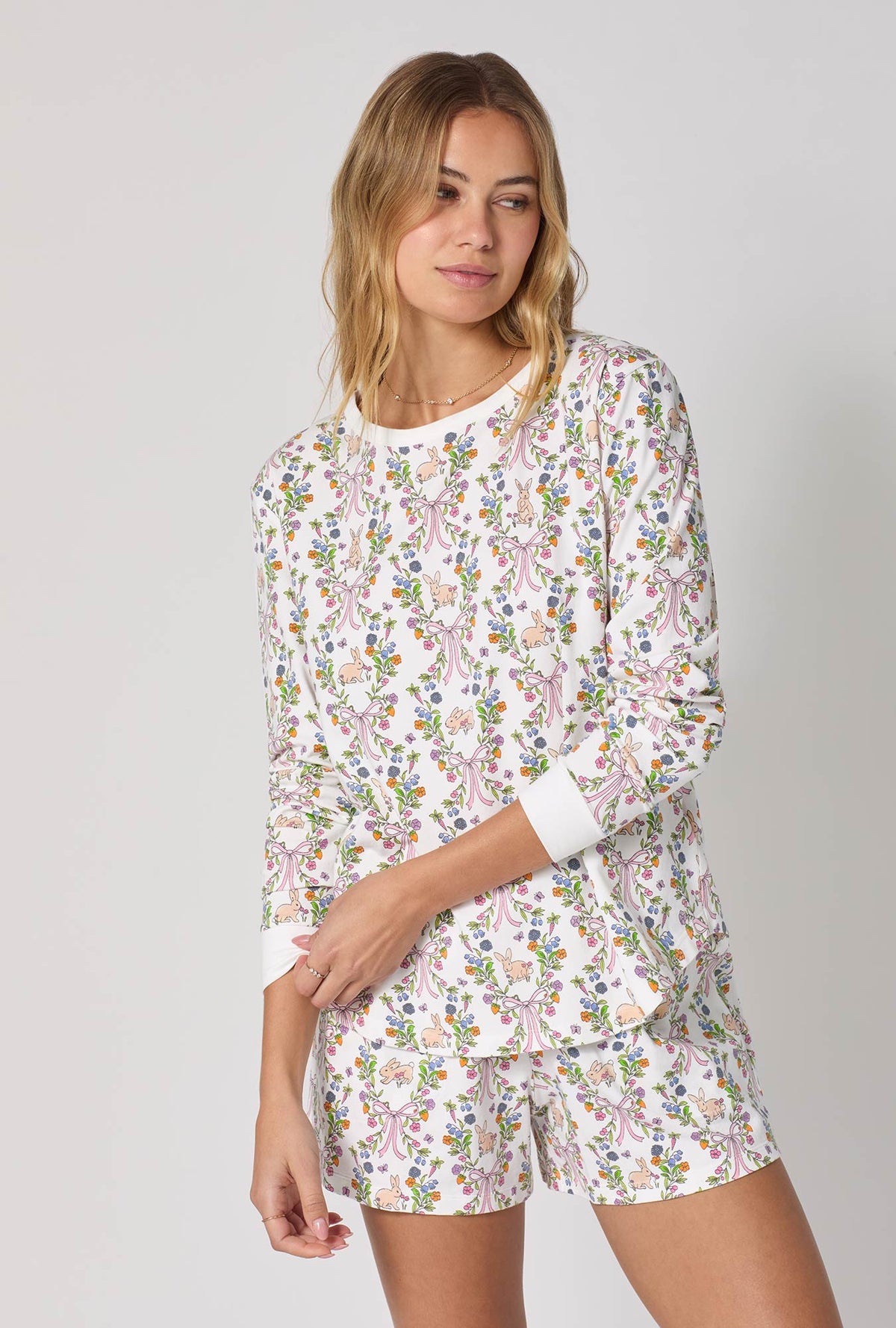 A lady wearing Bunny Blooms Long Sleeve Pullover Crew And Shorty Stretch Jersey Pj Set