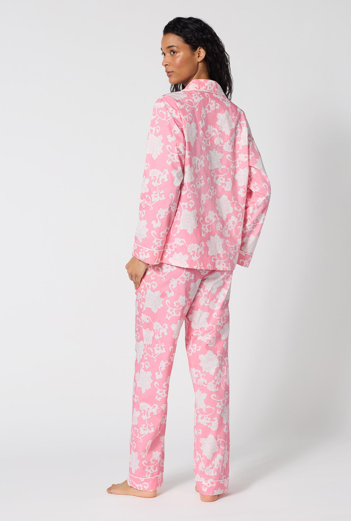 A Lady Wearing Dynasty Pink Long Sleeve Classic Woven Cotton Poplin Pj Set in a back view pose