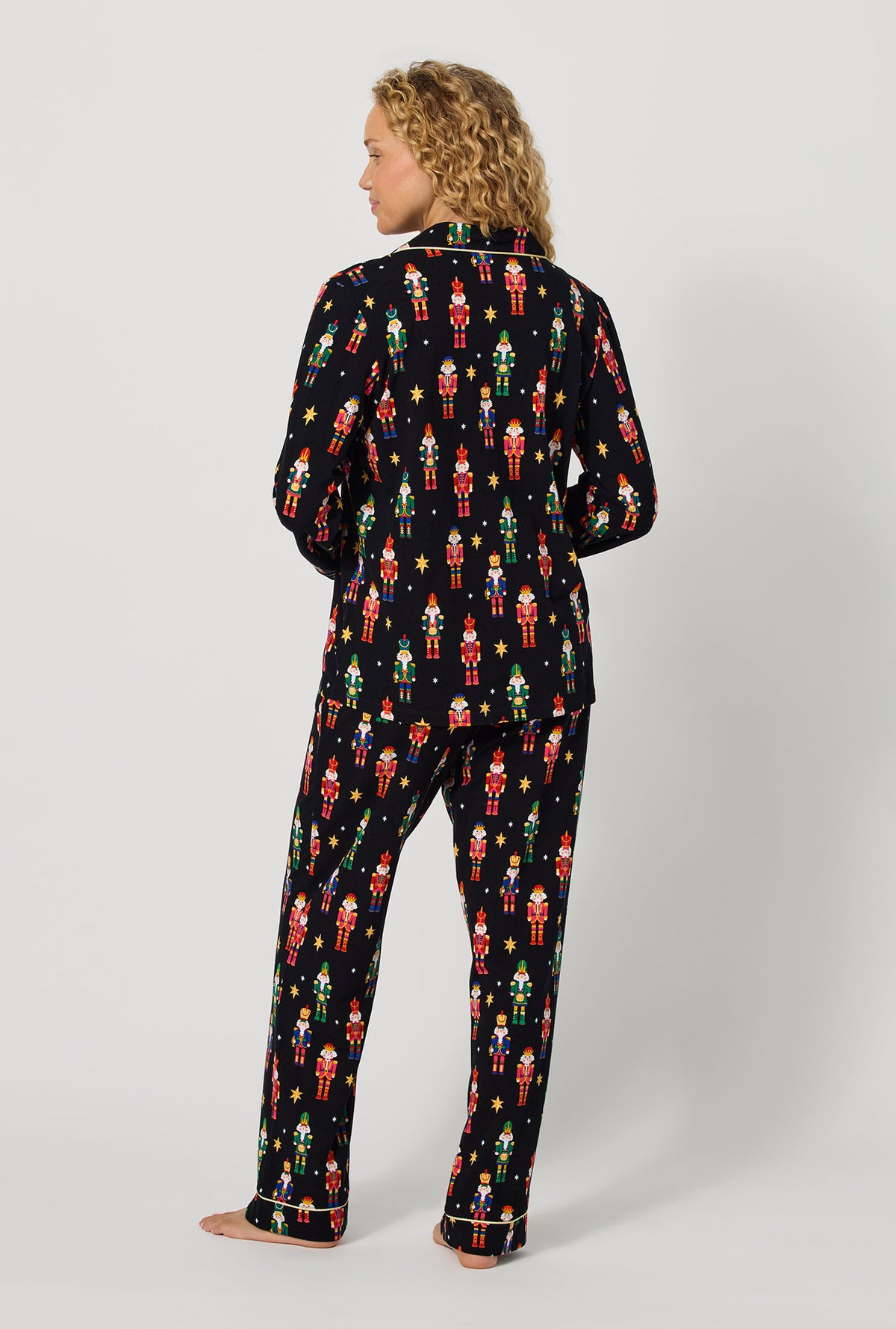 A lady wearing Twinkle & Drum Long Sleeve Classic Stretch Jersey Pj Set back view