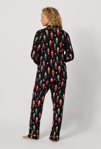 A lady wearing Twinkle & Drum Long Sleeve Classic Stretch Jersey Pj Set back view