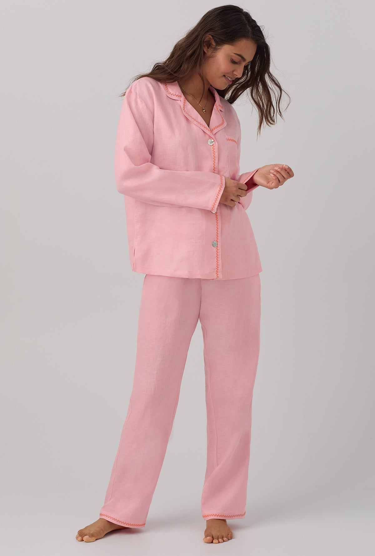 A lady wearing pink Long Sleeve Classic Linen PJ Set with Orchid Pink print.