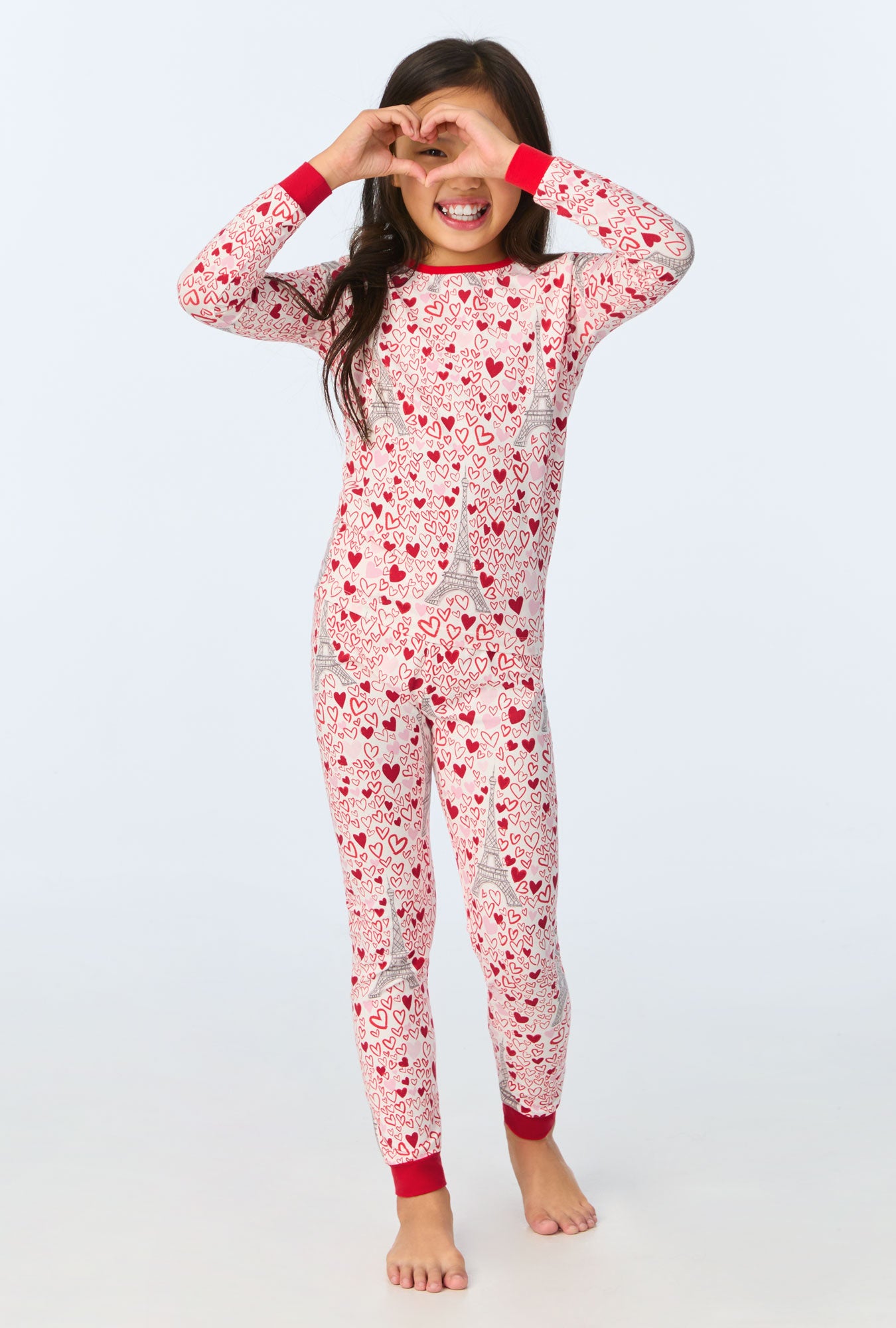 A girl wearing Paris Je Taime Long Sleeve Stretch Jersey Kids PJ Set