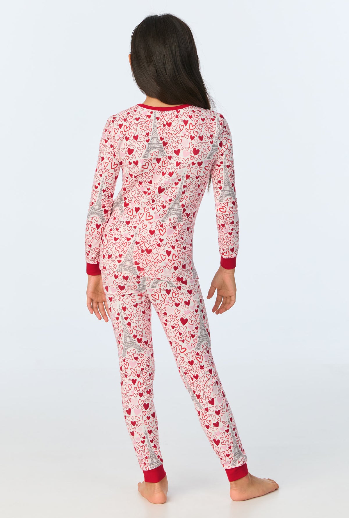 A girl wearing Paris Je Taime Long Sleeve Stretch Jersey Kids PJ Set