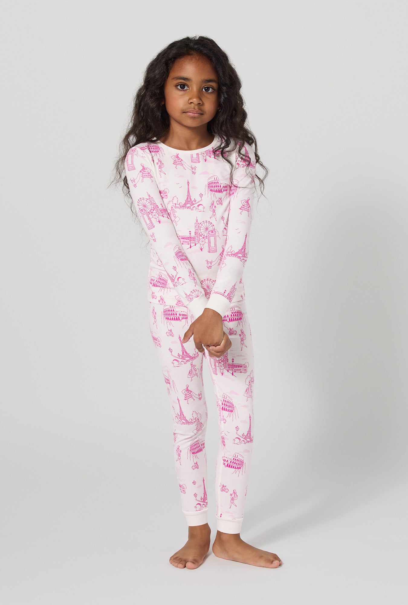 A girl wearing Jet Setter Long Sleeve Stretch Jersey Kids Pj Set