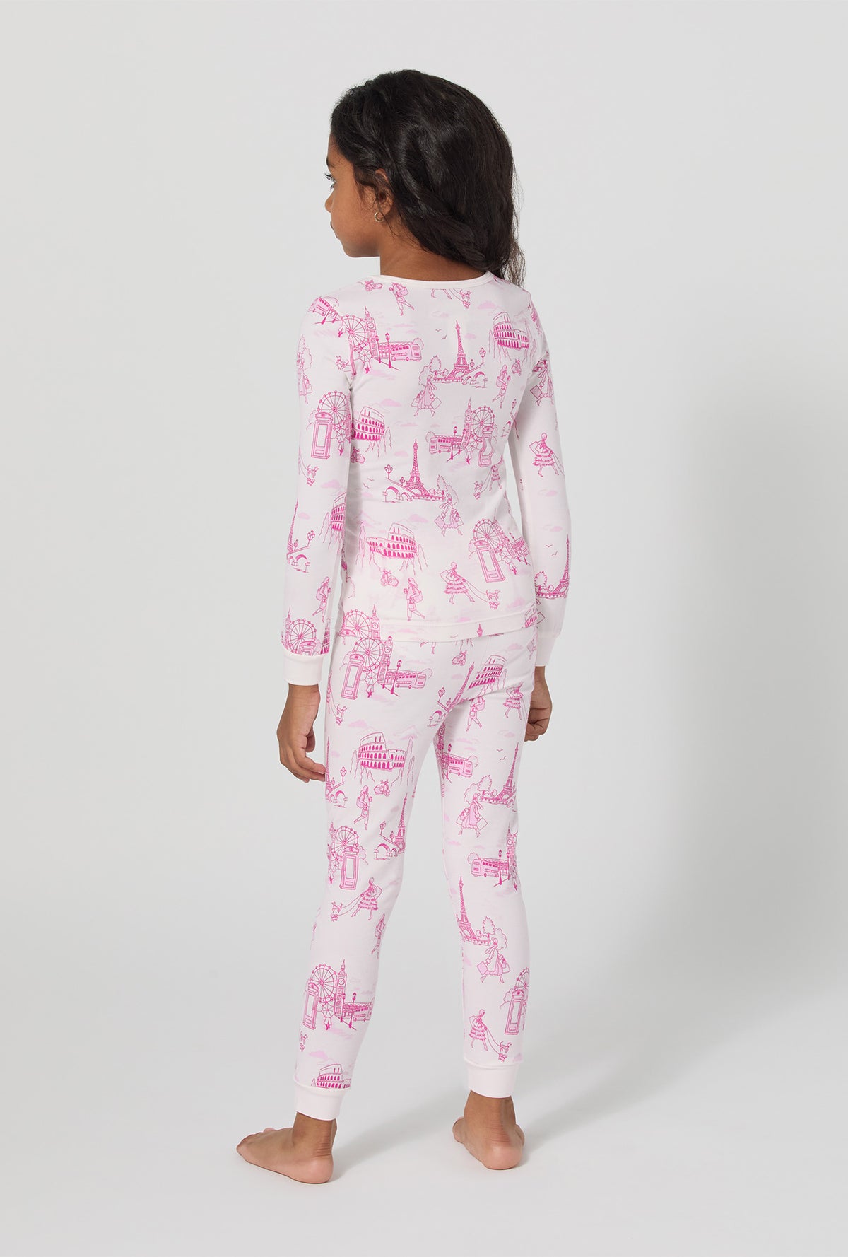 A girl wearing Jet Setter Long Sleeve Stretch Jersey Kids Pj Set