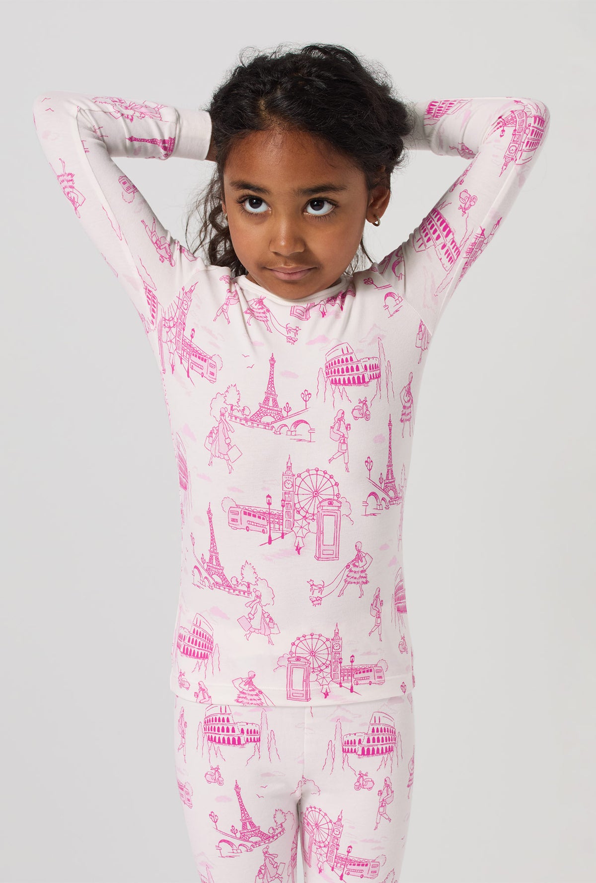 A girl wearing Jet Setter Long Sleeve Stretch Jersey Kids Pj Set