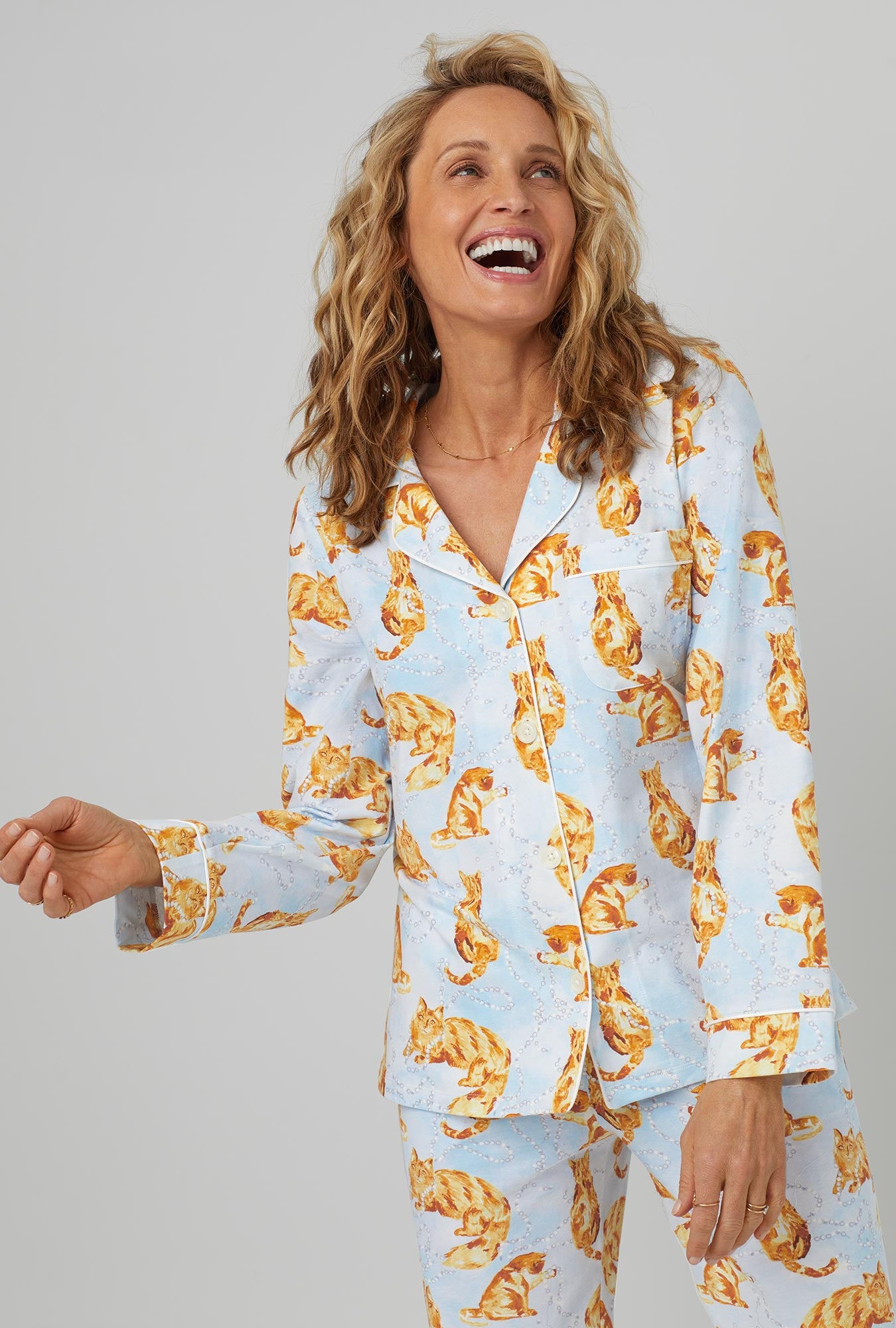A lady wearing long sleeve classic stretch jersey pj set with fancy cats print