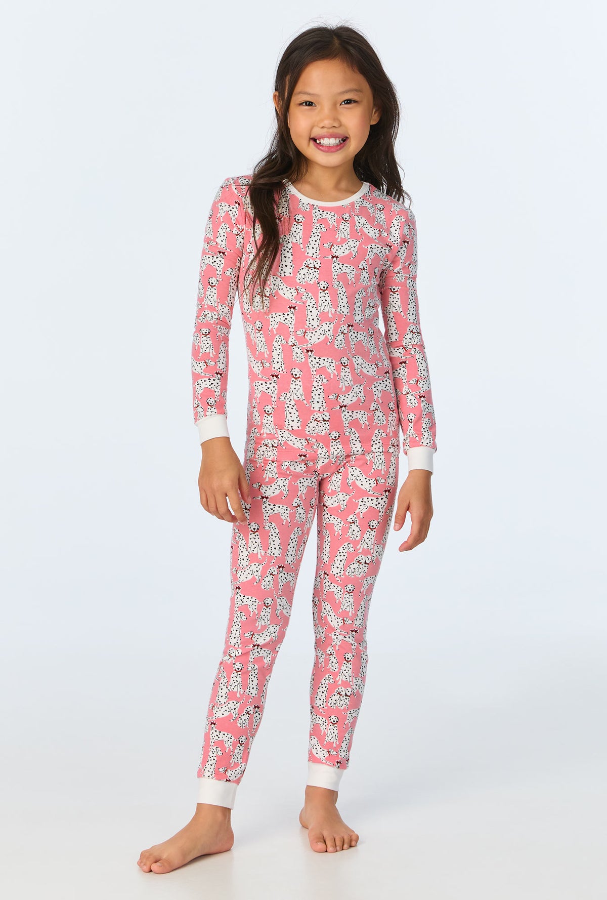 A girl wearing Love Spot Long Sleeve Stretch Jersey Kids PJ Set