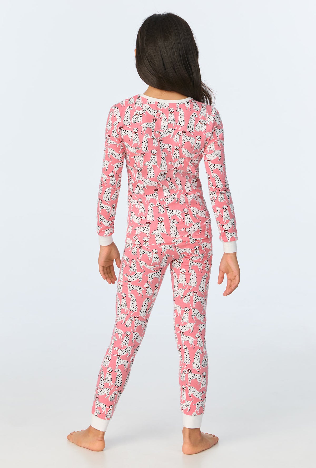 A girl wearing Love Spot Long Sleeve Stretch Jersey Kids PJ Set