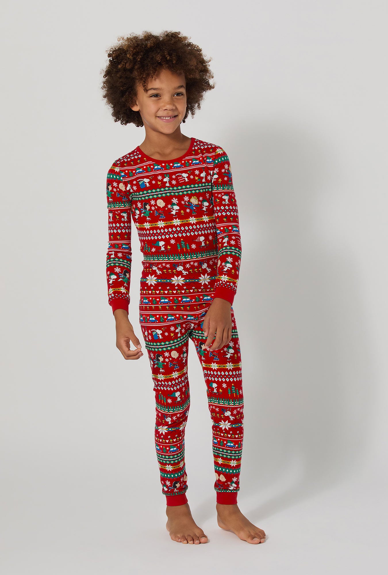 A girl wearing Peanuts®  Winter Fairisle Long Sleeve Stretch Jersey Kids Pj Set