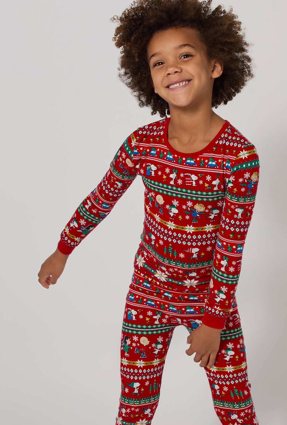 A girl wearing Peanuts®  Winter Fairisle Long Sleeve Stretch Jersey Kids Pj Set