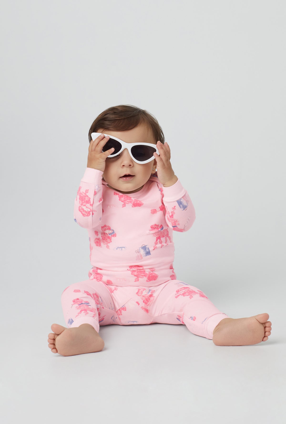 A baby wearing Pink  Long Sleeve Stretch Jersey Boo Boo PJ Set with Pampered Poodles  print
