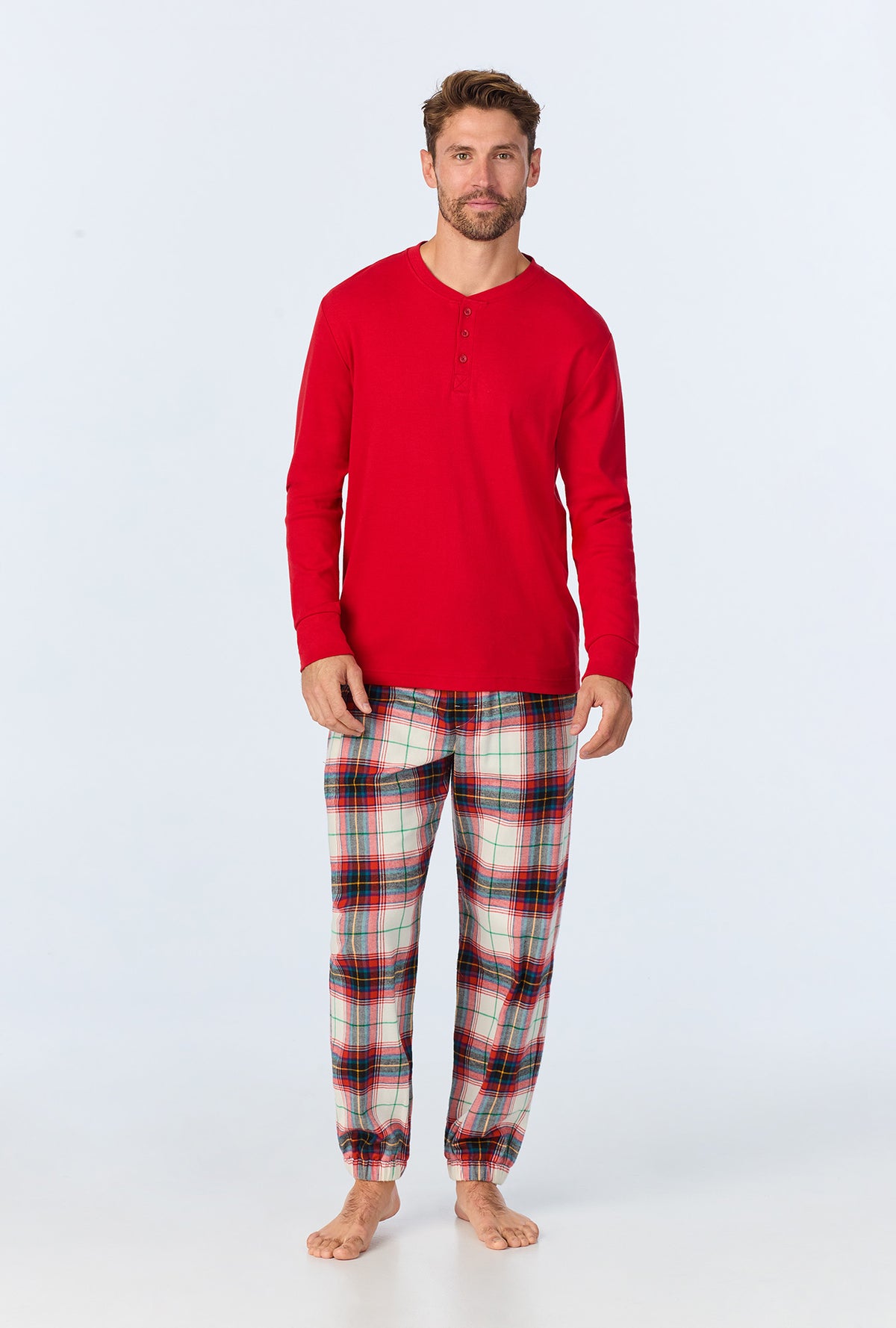 A man wearing Winter Tartan Men&#39;s  Long Sleeve Henley and Jogger Woven Portuguese Flannel  PJ Set