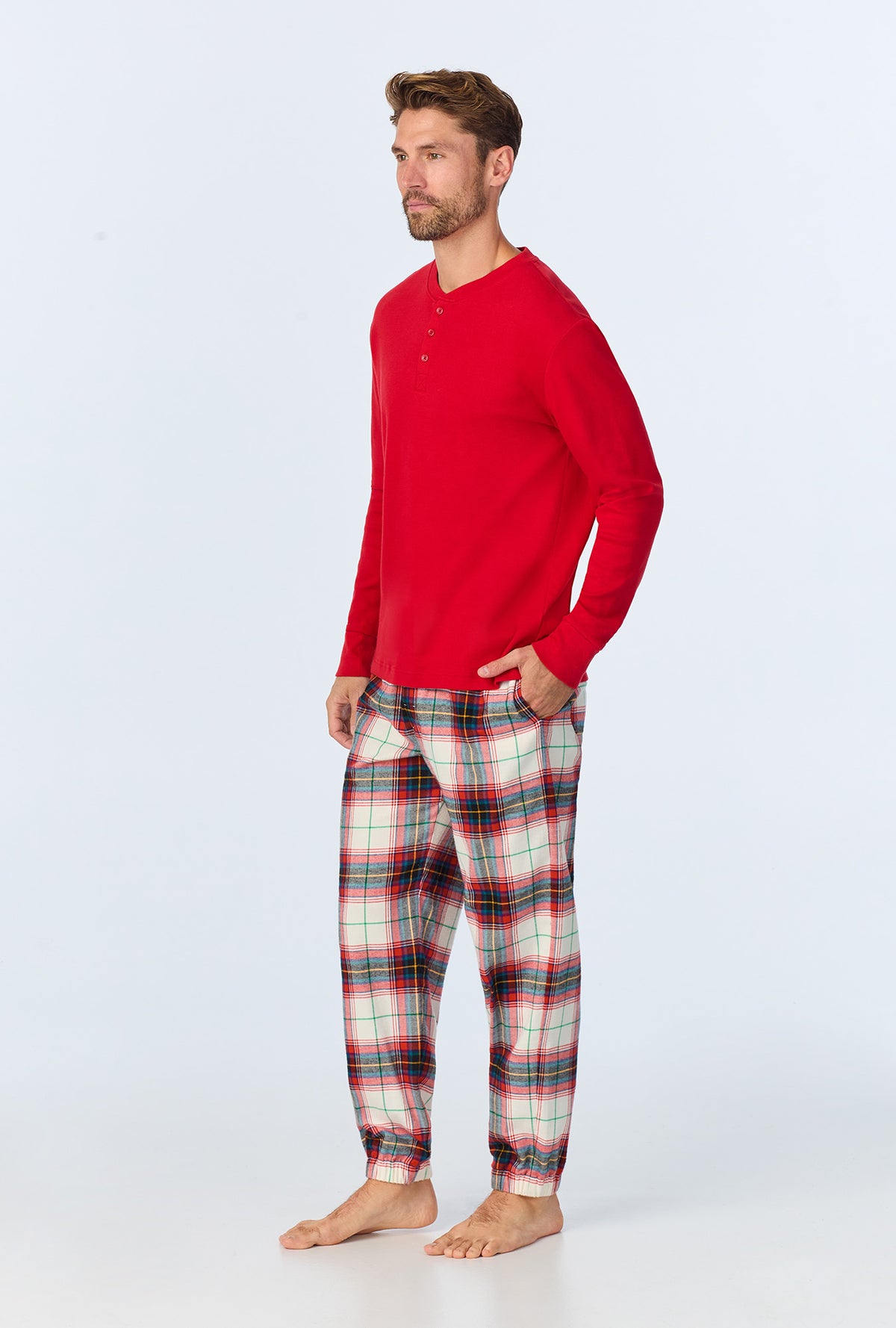 A man wearing Winter Tartan Men&#39;s  Long Sleeve Henley and Jogger Woven Portuguese Flannel  PJ Set