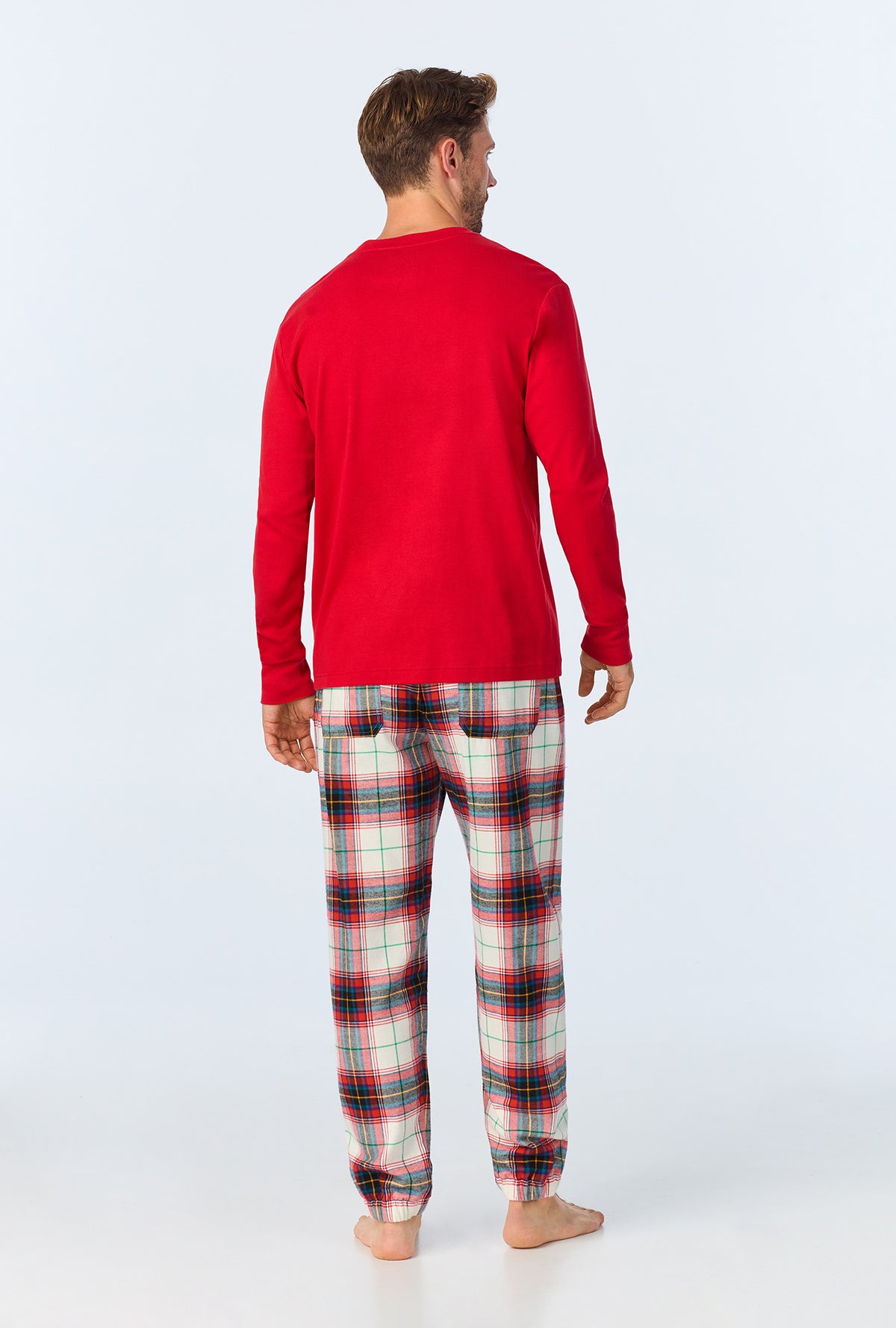 A man wearing Winter Tartan Men&#39;s  Long Sleeve Henley and Jogger Woven Portuguese Flannel  PJ Set