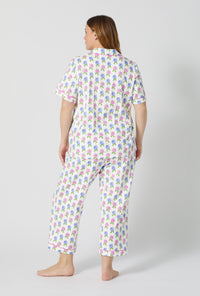 A lady wearing plus size Cottage Parlor Short Sleeve Classic Stretch Jersey Cropped Pj Set back view