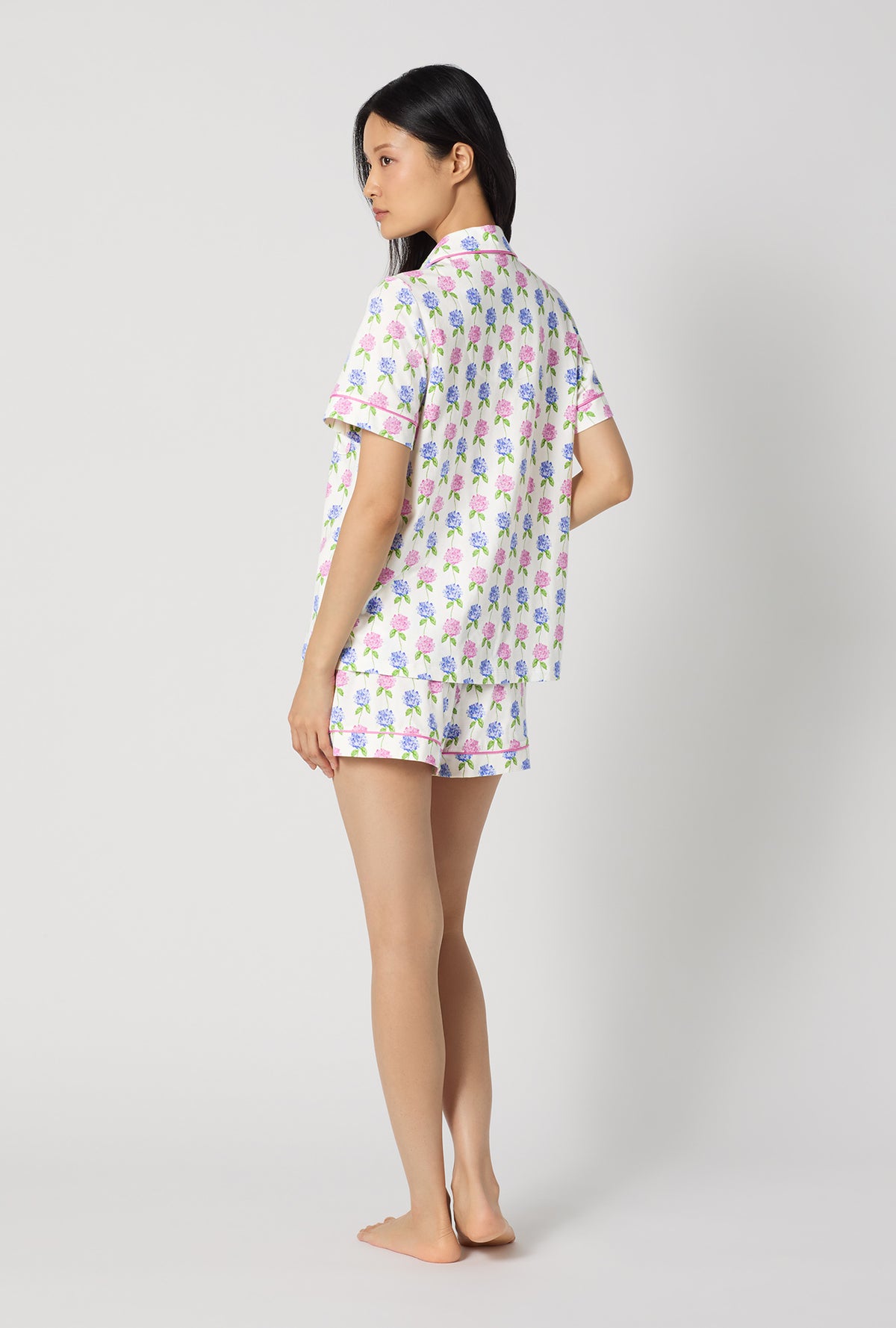 A lady wearing Cottage Parlor Short Sleeve Classic Shorty Stretch Jersey Pj Set back view
