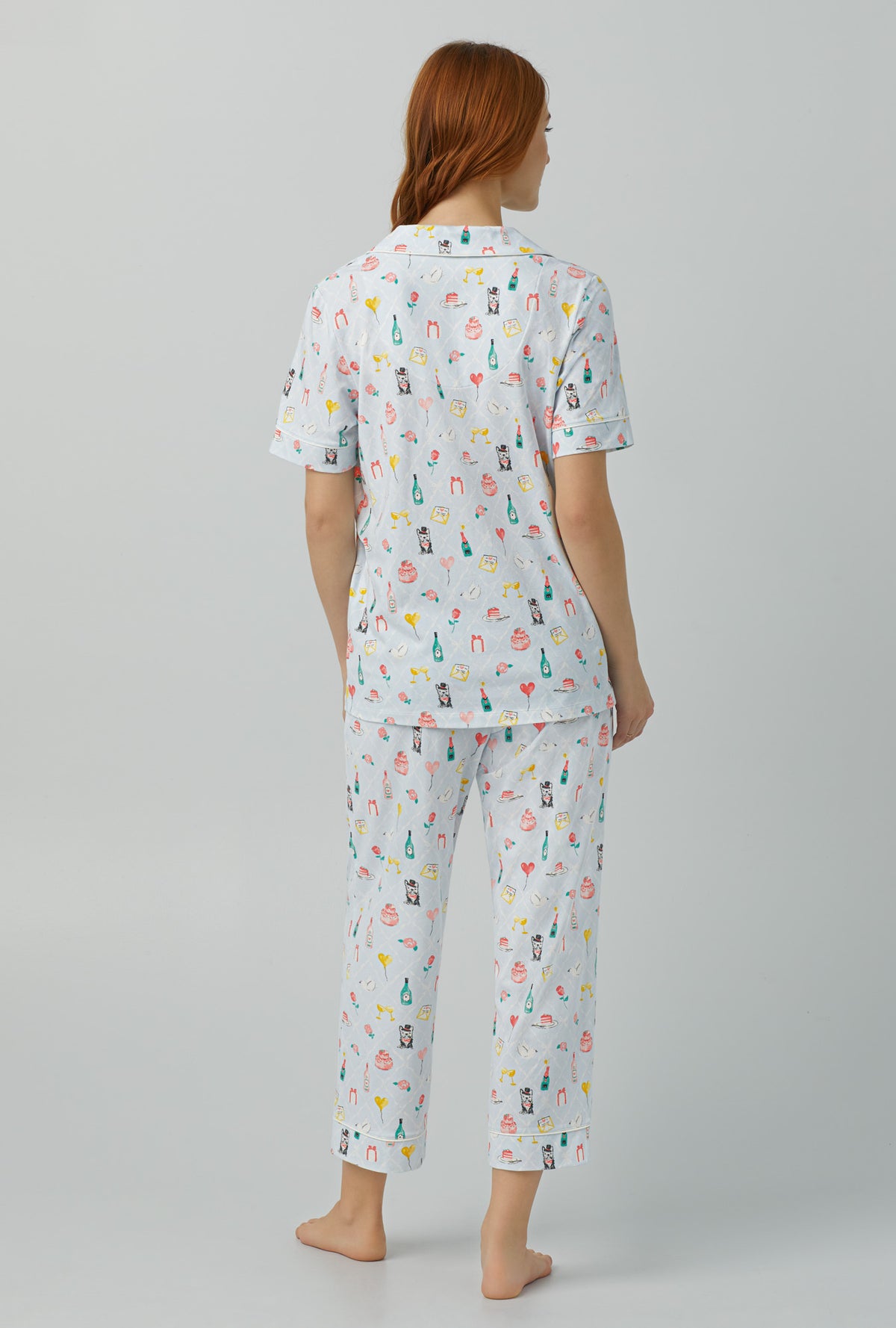 A lady wearing Short Sleeve Classic Stretch Jersey Cropped PJ Set with wedding party print