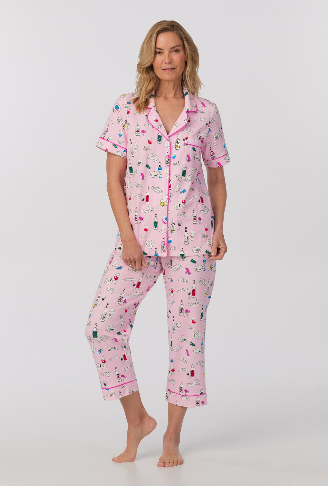 A lady wearing Short Sleeve Classic Stretch Jersey Cropped PJ Set with Wine Pairing print